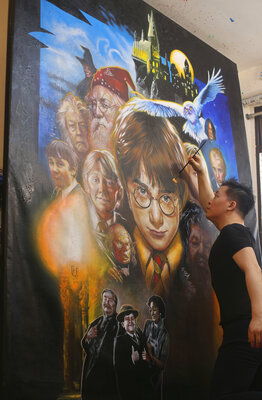 Michael Andrew Law working on a Large Drew Struzan's Harry Potter Painting